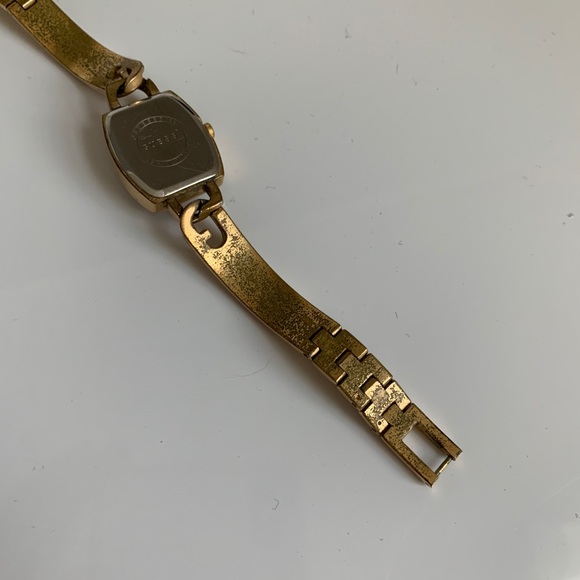 Guess interlocking G skinny gold watch
